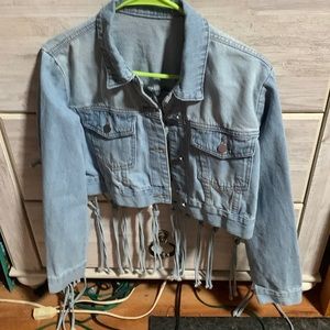 A SHEIN M denim jacket.2pockets in front and back of jacket is braided and open.